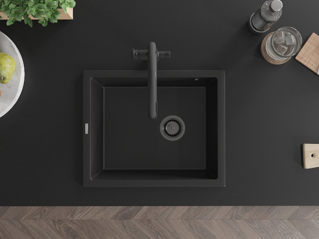 Под плотова стоманена мивка